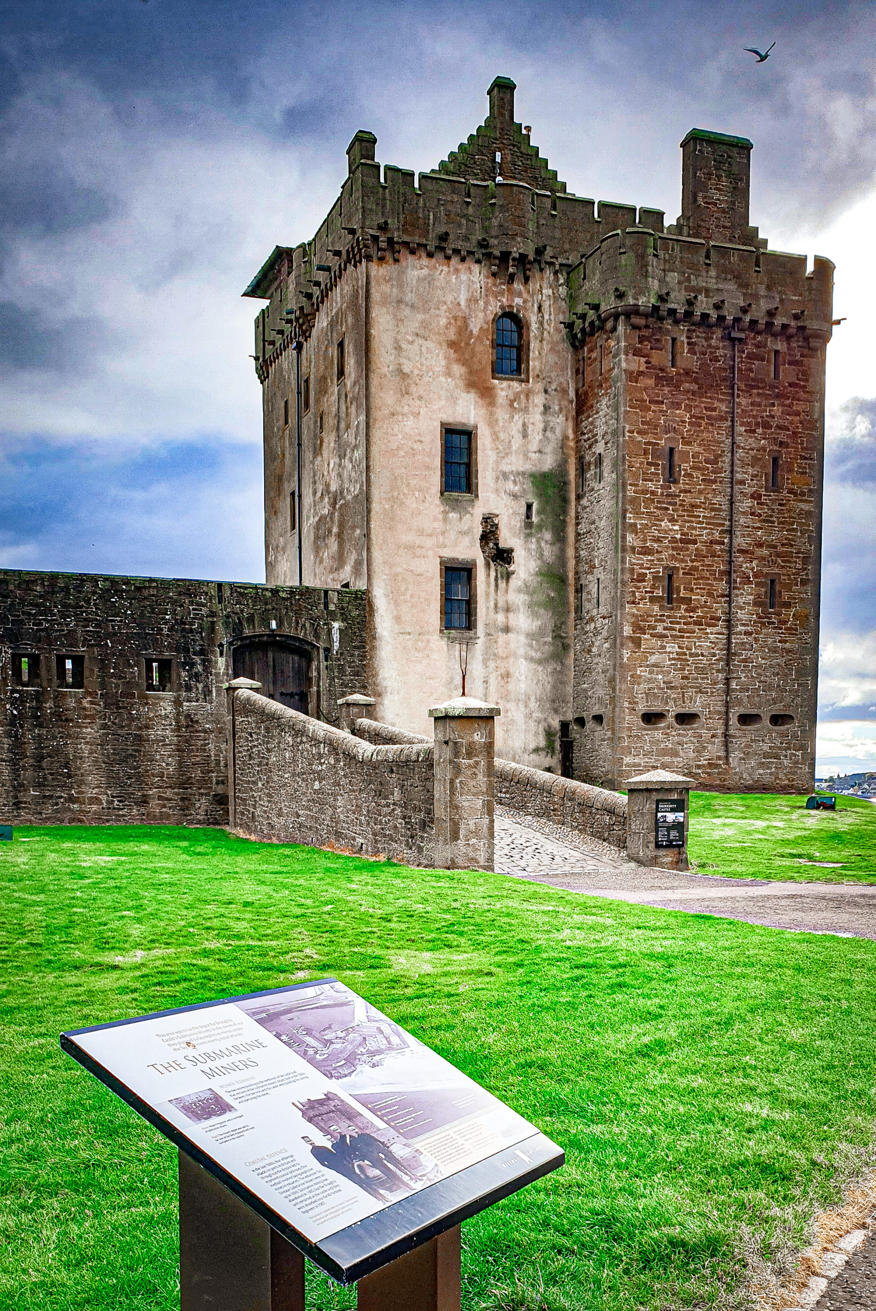 Outside the entrance to Broughty Ferry Castle, at the information board for submarine miners. The starting point of the audio walking tour of Broughty Ferry by DD Tours